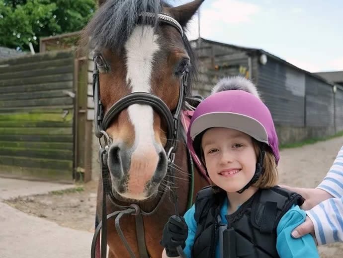 Imogen with her new helmet and cover, and her best friend!